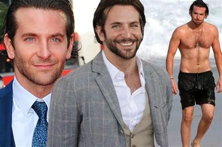 Bradley Cooper posing in a black suit.