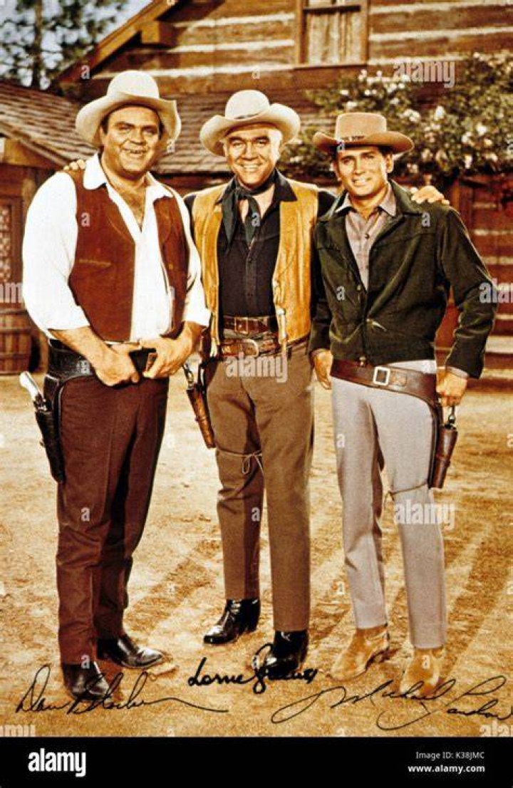 Dan Blocker, Michael Landon, Lorne Greene, and Pernell Roberts standing together in 'Bonanza'