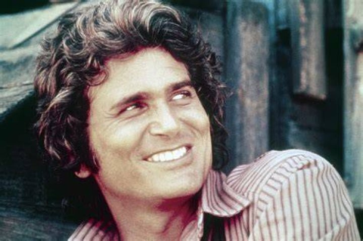 Michael Landon standing over a woman on the ground in 'Bonanza'