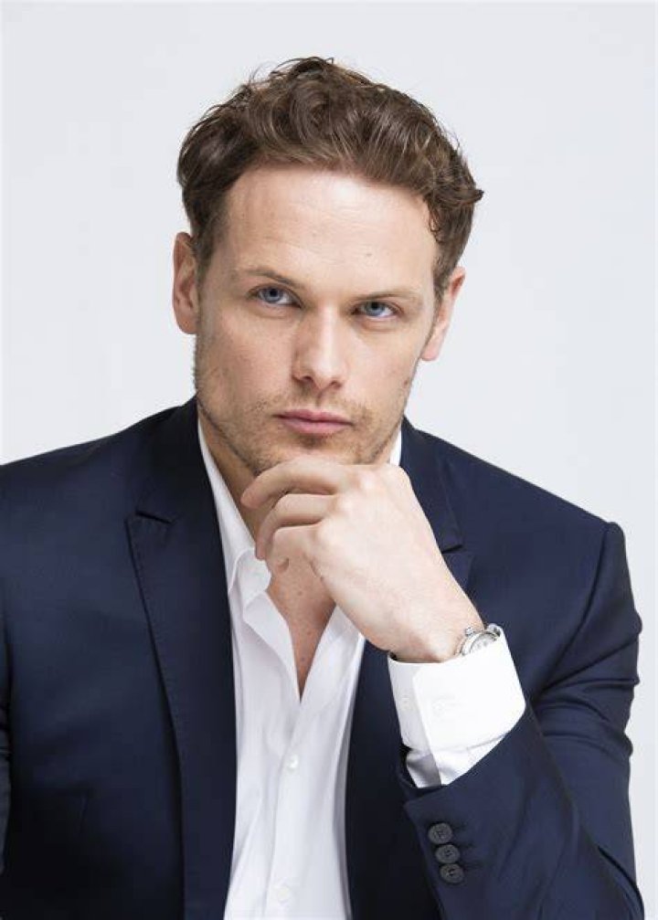 Sam Heughan posing in a suit at the the "Outlander" premiere during the 2023 Tribeca Festival.