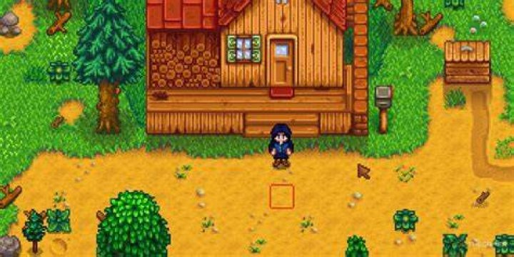 Stardew Valley. The player is standing on the left of the image in their kitchen. The kitchen has black and white tiles on the ground. The player is stood in front of their silver stove and to the left of a silver fridge. There is a wooden table and chair at the bottom of the image. 